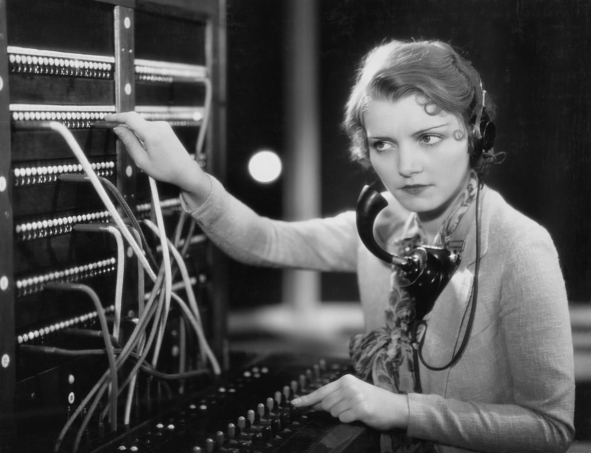 old-fashioned switchboard operator listening in